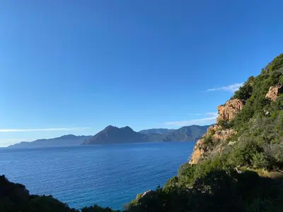 a view of the ocean from a mountain at Appartement sous les toits in Piana