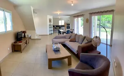a living room with a couch and chairs and a table at VILLA PETRETO in Petreto-Bicchisano