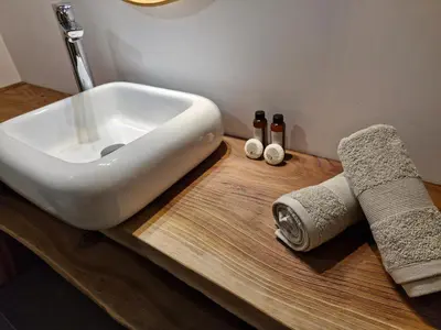 a bathroom with a sink on a wooden counter at NOUVEAUTE! Magnifique villa à 2 minutes des plus belles plages de la rive sud in Porticcio