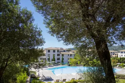 a view of a swimming pool in a resort at Domaine d'Arca - Eluard 04 - 6 pers in Porto-Vecchio