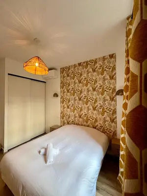 a bedroom with a bed with two teddy bears on it at Sublime T3 centre Ajaccio, équipé et climatisé in Ajaccio