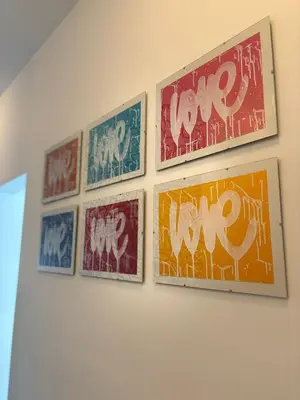 a group of pictures hanging on a wall at Villa Lavu Santu piscine privée vue mer/montagnes in Zonza