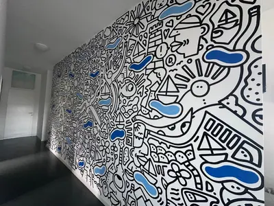 a wall covered in graffiti in a room at Villa Lavu Santu piscine privée vue mer/montagnes in Zonza