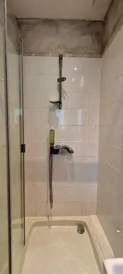 a shower with a glass door in a bathroom at Villa Bella Vista, 4ch, piscine in Figari