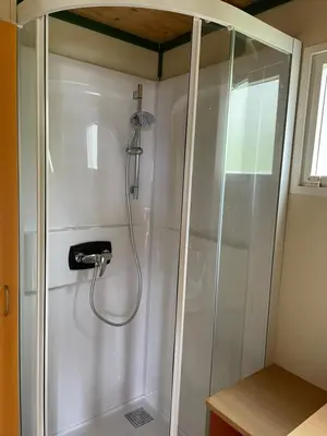 a shower with a hose in a bathroom at La vallee 3 in Belvédère