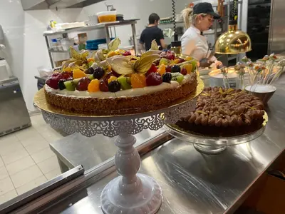 a cake sitting on a counter in a kitchen at La Manufacture D'oriano LES NUITS AU VILLAGE in Montegrosso