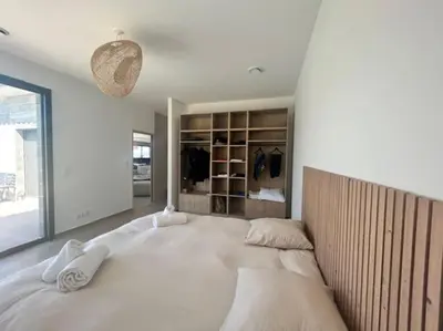 a bedroom with a large bed in a room at Villa Trinita Paradis privé piscine et loisirs in Porto-Vecchio