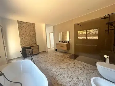 a large bathroom with a tub and a sink at Villa Trinita Paradis privé piscine et loisirs in Porto-Vecchio