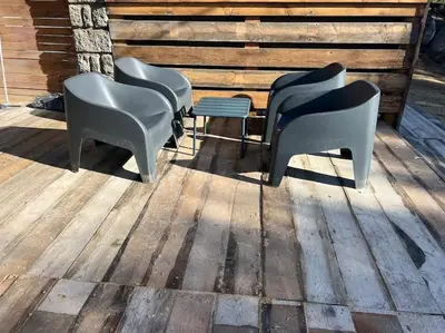 a group of chairs sitting on a wooden deck at A nepita di porto vecchio*** in Porto-Vecchio