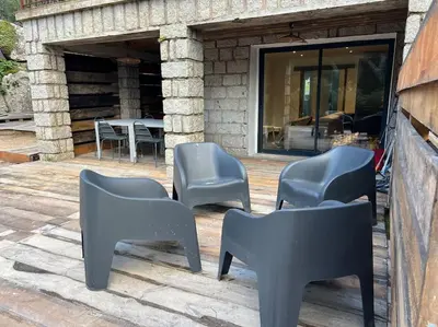 a group of chairs sitting on a patio at A nepita di porto vecchio*** in Porto-Vecchio