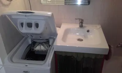 a white sink in a bathroom with a trash can at Haute Corse. Studio 4 pers .Plage Piscine. Cervione Prunete . in Cervione