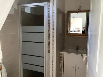 a bathroom with a sink and a mirror at Maison de charme entre mer et montagne in Forciolo