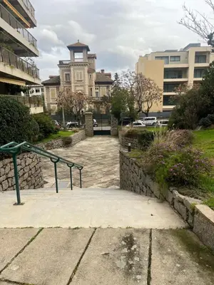 a building with a staircase in front of a building at Appartement douillet en ville in Ajaccio