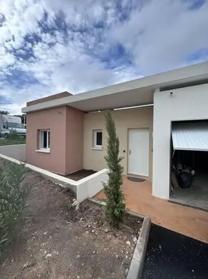 a house with a tree in front of it at Maison Joepolly corsica in Bonifacio