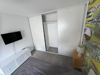 a room with a tv and a bed in it at Maison Joepolly corsica in Bonifacio