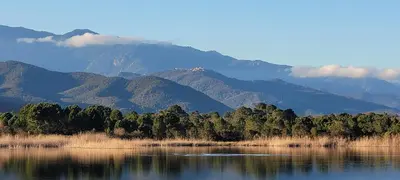 a view of a lake with mountains in the background at CASA DI SIGNARE in Ventiseri