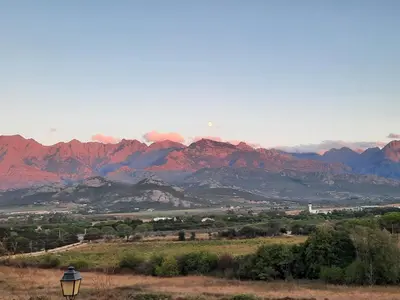 a view of a mountain range with a street light at Location L'épi d'or Calvi, demeure de charme in Calvi