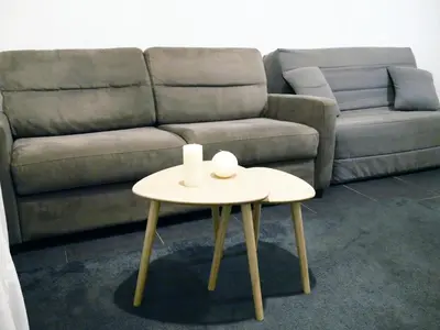 a living room with a couch and a table at Capstay studio avec grande terrasse proche aéroport Bastia - Lucciana - Centre in Lucciana