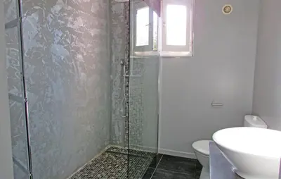 a bathroom with a shower with a toilet and a sink at Beautiful Home In Venzolasca With Wifi in Camp du Cap Sud
