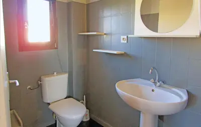 a bathroom with a sink and a toilet at Beautiful Home In Venzolasca With Wifi in Camp du Cap Sud