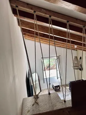 a swing in a room with a window at Casa Mare, CABANON SUR LA PLAGE à Ajaccio vue sanguinaires in Ajaccio