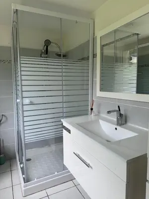 a bathroom with a sink and a glass shower at I Tre Taglincchi, U Terzu - Proche mer, Clim, Wifi, Parking gratuit in Taglio-Isolaccio