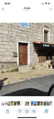 a screenshot of a building with a wooden door at Très beau studio avec terrasse in Zonza