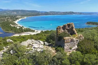an old castle on a hill next to a beach at T3 Madiana, Climatisé, piscines, resto, 5mn plages in Lecci