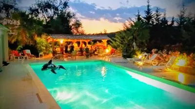a swimming pool with a person in the water at Casalta di san ghjuva in Eccica-Suarella