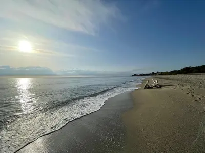 a beach with a few chairs and the ocean at T2 VUE MER MARINA DI BRAVONE N197 in Linguizzetta