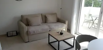 a living room with a couch and a table at T2 VUE MER MARINA DI BRAVONE N197 in Linguizzetta