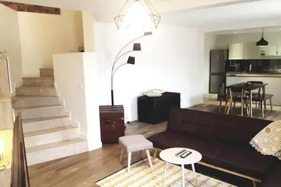 a living room with a couch and a table at Magnifique bergerie corse du 17eme Siècle à proximité des plages in Eccica-Suarella