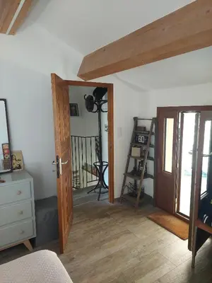 a room with a wooden door and a wooden floor at Maison de charme Orezza Haute-Corse Castagniccia in Carpineto