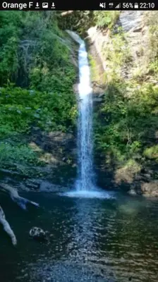 a waterfall in the middle of a body of water at Maison de charme Orezza Haute-Corse Castagniccia in Carpineto