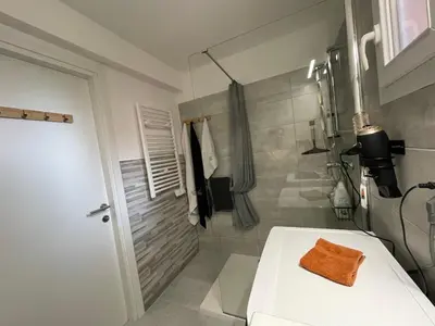 a bathroom with a toilet with a towel on it at Villa A CASA DI LO in Lecci