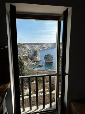 a view of the ocean from a window at Appartement U Diu Grossu in Bonifacio