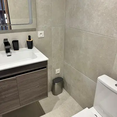 a bathroom with a sink and a toilet at Appartement U Diu Grossu in Bonifacio
