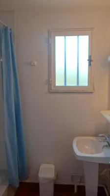 a bathroom with a sink and a window at Residence Funtanella in Sagone