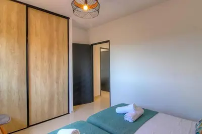 a bedroom with a bed and a large closet at Villa Stella avec piscine entre mer et rivière in Vardiola