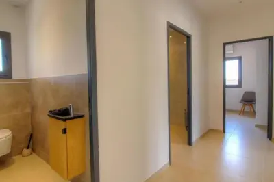 a room with a hallway with a toilet and a door at Villa Stella avec piscine entre mer et rivière in Vardiola