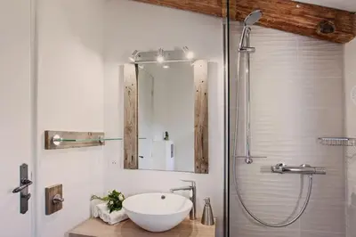 a bathroom with a sink and a shower at Beautiful Apartment 