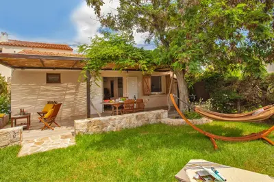 a hammock in the yard of a house at Villa 