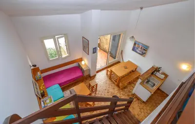 an overhead view of a room with a bed and a table at 2 Bedroom Cozy Home In Grosseto-Prugna in Grosseto-Prugna