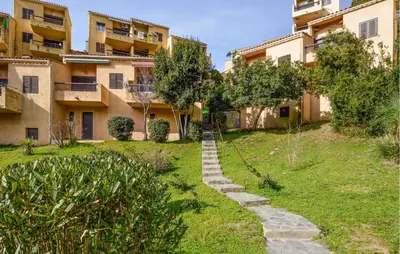 a garden in front of an apartment building at 2 Bedroom Cozy Home In Grosseto-Prugna in Grosseto-Prugna