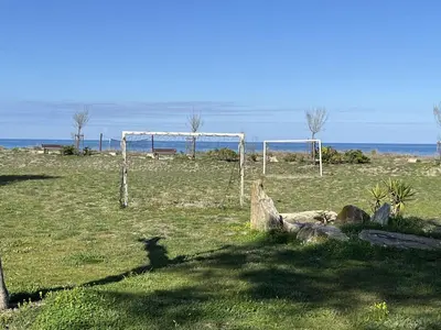 a field with two soccer goals in a field at BORGO Duplex 4 pers proche mer in Borgo