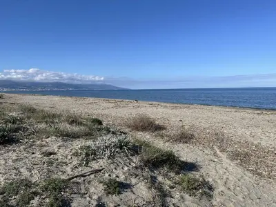 a sandy beach with the ocean in the background at BORGO Duplex 4 pers proche mer in Borgo