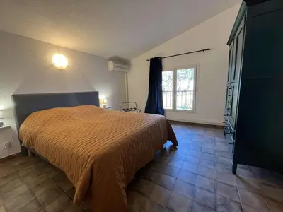 a bedroom with a bed and a window at BORGO Duplex 4 pers proche mer in Borgo