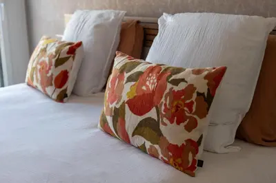 a bed with two pillows on top of it at Agosta: Terrace with sea view - Luxury flat | By Airnest in Albitreccia