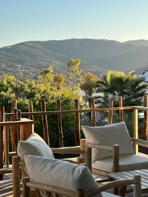 a couple of chairs sitting on top of a deck at Villa Casa di Simone Pietrosella Corse du Sud in Pietrosella