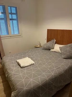 a bedroom with a bed with a pillow on it at Bas de villa pour 6 in Venzolasca